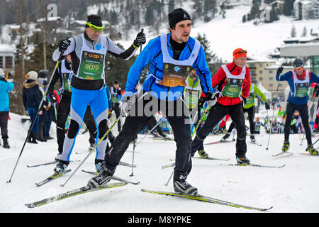 Cross country skiers at the Engadin Skimarathon on the climb to the Stazer Wald hill, 50th Engadin Skimarathon, 11 March 2018, St. Moritz, Switzerland Stock Photo