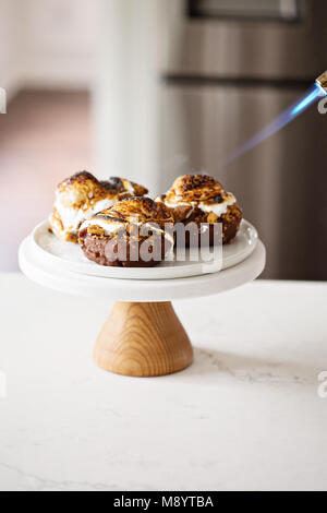 Smores donuts on a cake stand Stock Photo