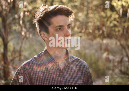 Portrait of serious thoughtful teenage boy outdoors Stock Photo