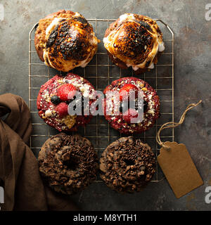 Variety of donuts on a cooling rack Stock Photo