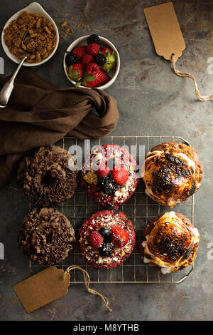 Variety of donuts on a cooling rack Stock Photo