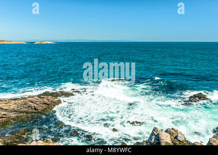 Rocks formation in the blue sea looks like a face in Sozopol, Bulgaria. Stock Photo