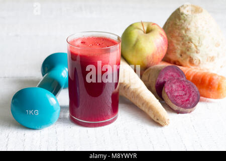 Glass of organic juice with raw fruit and vegetables and juicer Stock Photo