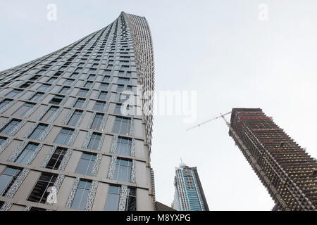 DUBAI, UAE - February 14, 2018: View of new Cayan Tower a modern skyscraper with twisted design in Marina district of Dubai, UAE Stock Photo