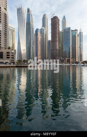 DUBAI, UAE - February 14, 2018: Morning view of modern skyscrapers with reflection in Dubai Marina, UAE Stock Photo