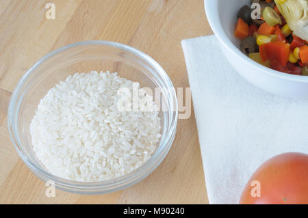 Top view of ingredient for Italian rice salad, summer dish with rice, pickles, tomato Stock Photo