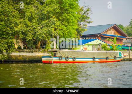 Long-tail boat parked in a riverside in Bangkok yai canal or Khlong Bang Luang in Thailand Stock Photo