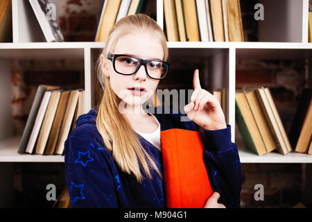 Teenage girl in a library Stock Photo