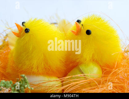 Easter decorations. On the picture two chickens with eggs in the brood. Stock Photo