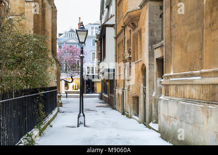 Lamp post in the snow in St Mary's Passage in the early morning snow. Oxford, Oxfordshire, England Stock Photo