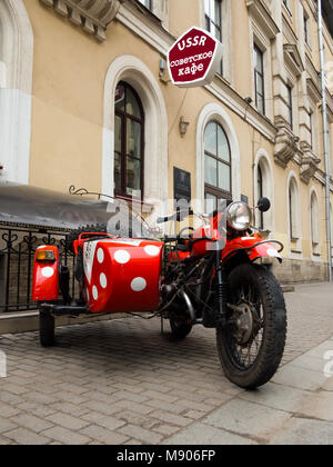 Saint-Petersburg, Russia - February 13, 2016: The old Soviet motorcycle at the entrance of USSR cafe on Malaya Sadovaya street Stock Photo