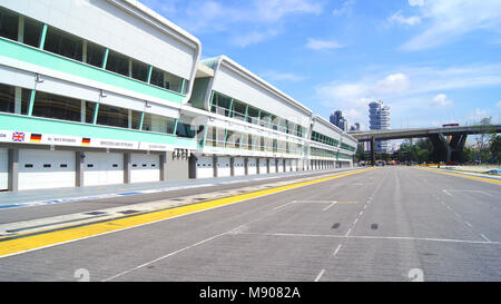 SINGAPORE - APR 2nd 2015: Pit lane and start finish line of the Formula One Racing track at Marina Bay Street Circuit. The symbol of Formula One Racing once a year around Marina Bay, attracted more than 100,000 tourists Stock Photo