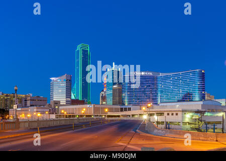 DALLAS, TX - DECEMBER 10, 2017 - Downtown Dallas skyline at night with illuminated glass buildings seen from Houston Street Stock Photo