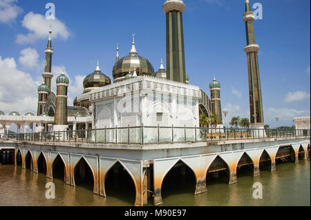 The Crystal Mosque (Masjid Kristal) in Koala Terengganu, Malaysia. Golden minarets made of steel and glass, sparkle in the sun against a blue sky Stock Photo