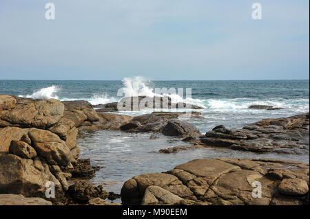 Waves crashing over granite rock formations at Rivermouth Beach, Prevelly near Margaret River in West Australia Stock Photo