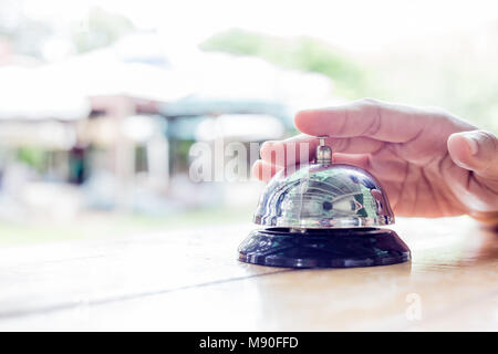 Service Bell. Person using their finger to ring a counter bell.ฃ Stock Photo