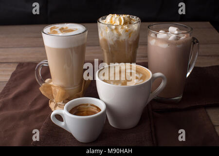 Assortment of coffee beverages on brown napkins Stock Photo