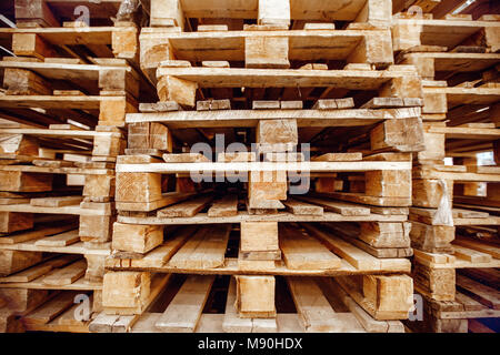 Wooden pallets stacked a warehouse Stock Photo