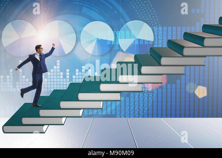 Businessman student climbing the ladder of education books Stock Photo