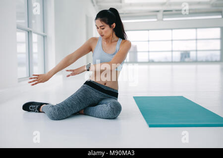 Free: Fitness young woman stretching his leg with the help of barre in  dance studio Free Photo - nohat.cc