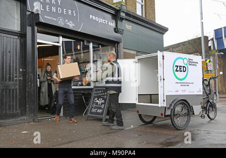 Staff from a Zero Emissions delivery company use an electric cargo trike to distribute goods in Walthamstow, North London. Stock Photo