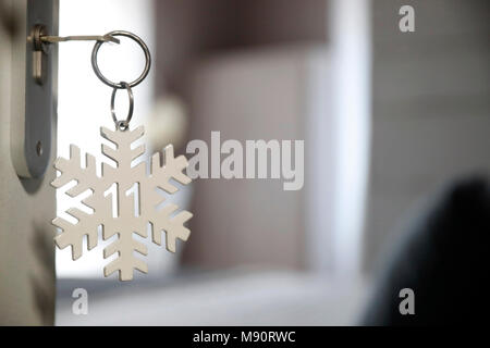 A hotel room door lock and key. Stock Photo