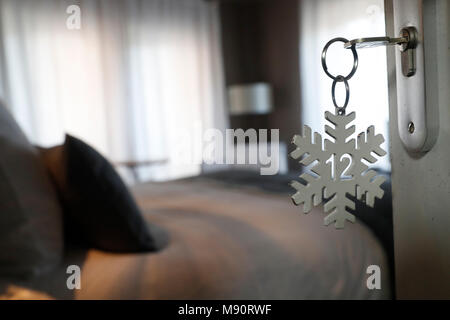 A hotel room door lock and key. Stock Photo