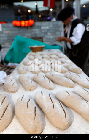 The agriculture fair (Comice Agricole) of Saint-Gervais-les-Bains. Baker making artisan bread. Stock Photo