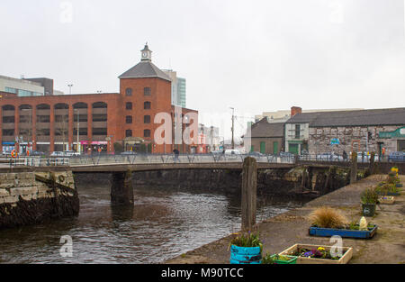 Some of the narrow streets and a foot bridge in Cork Ireland on the Father Mathew Quay alongside the River Lee that runs through the city Stock Photo