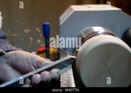 Man working on a wood lathe. Stock Photo