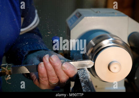 Man working on a wood lathe. Stock Photo