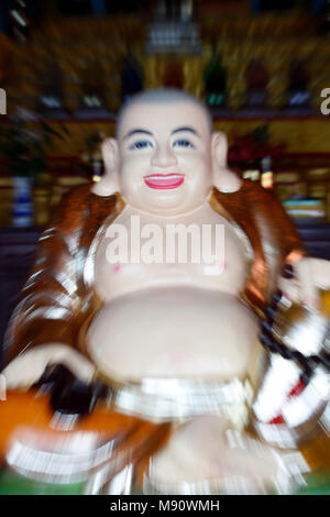 Chua Tu Quang buddhist temple. Happy Buddha statue for good luck and fortune. Vung Tau. Vietnam. Stock Photo