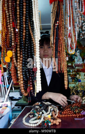 Truc Lam buddhist temple. Various buddhist religious merchandise items on sale. Prayer beads or malas.  Dalat. Vietnam. Stock Photo