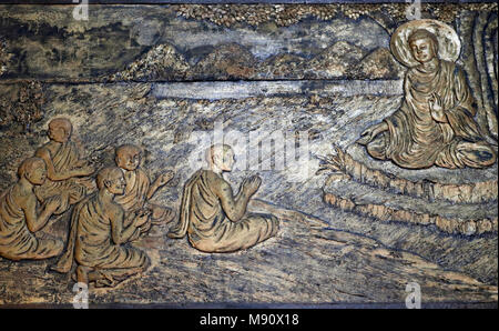 Chua Ho Quoc pagoda. The life story of Shakyamuni Buddha. The first discourse. The Buddha preaching the sermon - the wheel of law - to his five discip Stock Photo