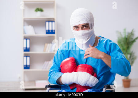 Injured boxer recovering in hospital Stock Photo