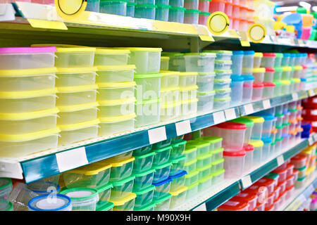 Plastic food containers on the shelf in the store Stock Photo