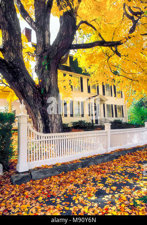A formal white fence in front of a Colonial style home, the Lynde Lord House, located in New Haven, Connecticut, United States. Stock Photo