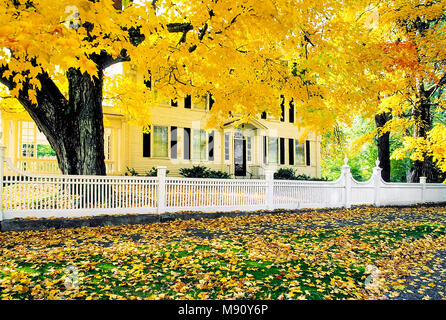A formal white fence runs along the front yard of the Lynde Lord House in New Haven, Connecticult, United States. Stock Photo