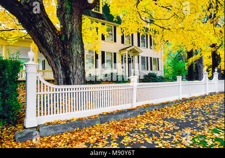 Formal white fence in tront of the Lynde Lord House in Autumn located in New Haven, Connecticut, United States. Stock Photo