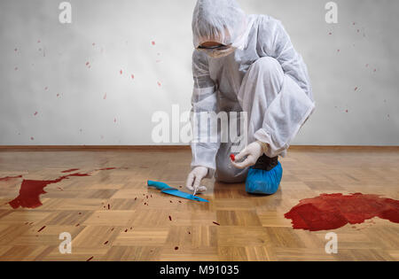 Crime scene investigation, taking DNA sample from blood stain with cotton swab on murder crime scene. Stock Photo