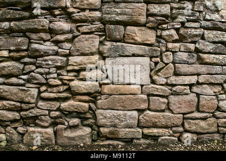 Dry stone wall background with a variety of flat stones at Finchale Priory in the North East of England, County Durham Stock Photo