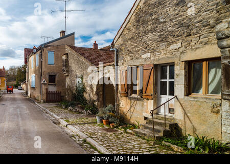 Old medieval houses on the cobbled street in ancient french village Noyers, France Stock Photo