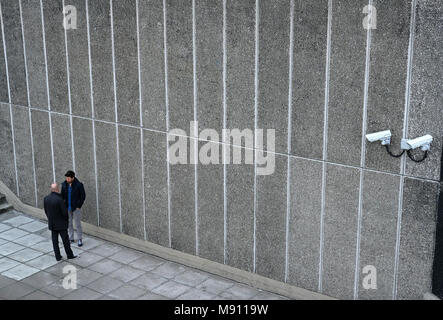 Two men and security cameras on the South Bank in London. Stock Photo