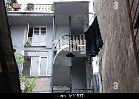 Laundry drying on a rope in the courtyard in Batumi, Adjara, Georgia. Stock Photo