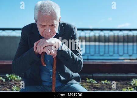 Portrait of focused sad man passing his life in review Stock Photo