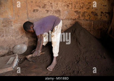 Smithy in Bohicon, Benin. Child worker. Stock Photo