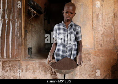 Smithy in Bohicon, Benin. Child worker. Stock Photo