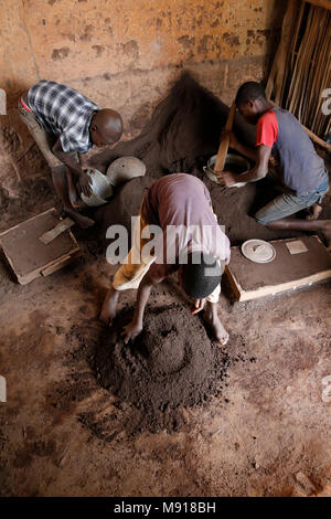 Smithy in Bohicon, Benin. Child workers. Stock Photo