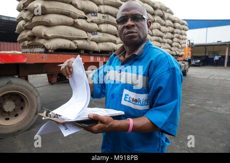 Employee at Abidjan port facilities, Ivory Coast. Stock Photo