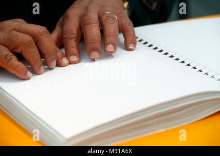 Man reading  the Holy Bible in braille.  Strasbourg. France. Stock Photo